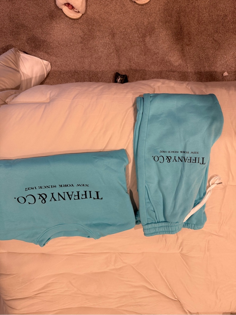 Tiffany & Co. Women’s Aqua sweatshirt and sweatpants.